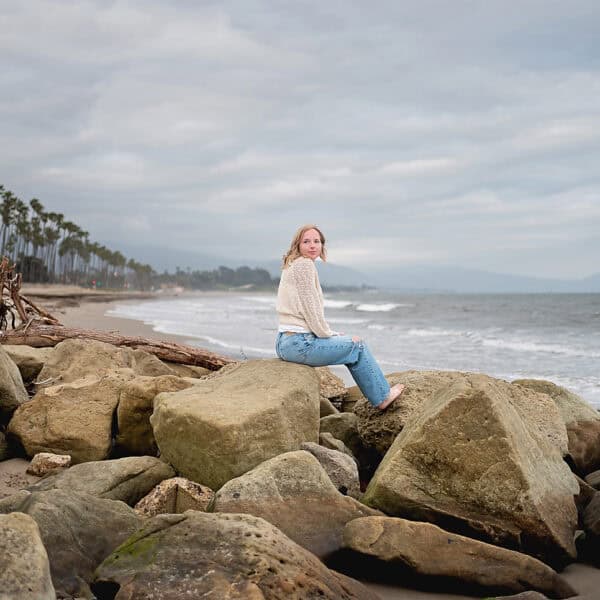 cream top and jeans at the beach senior session