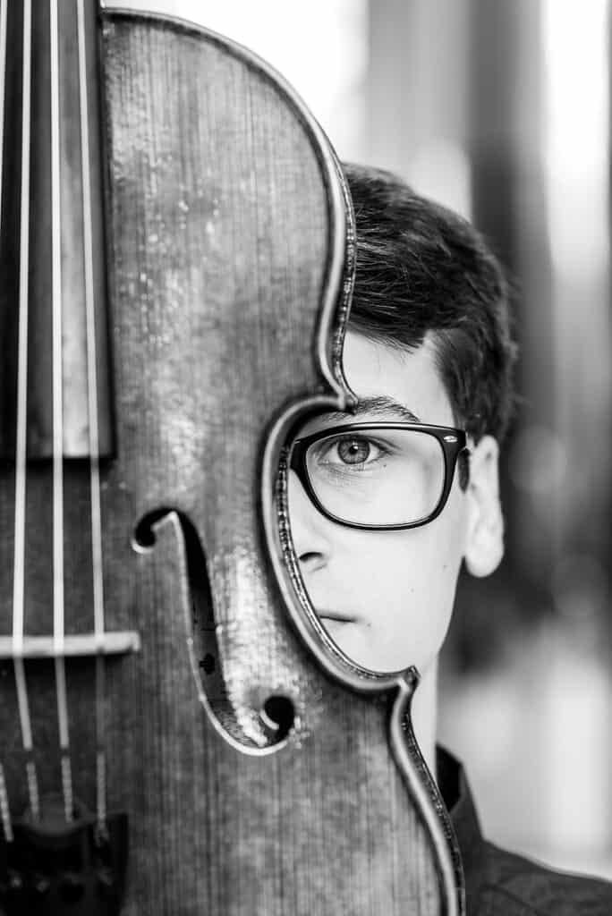 black and white photo of a senior guy and a viola