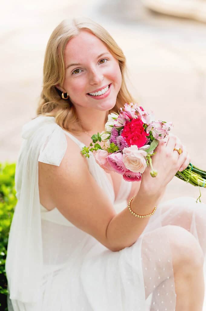 pink flowers and white dress senior photography